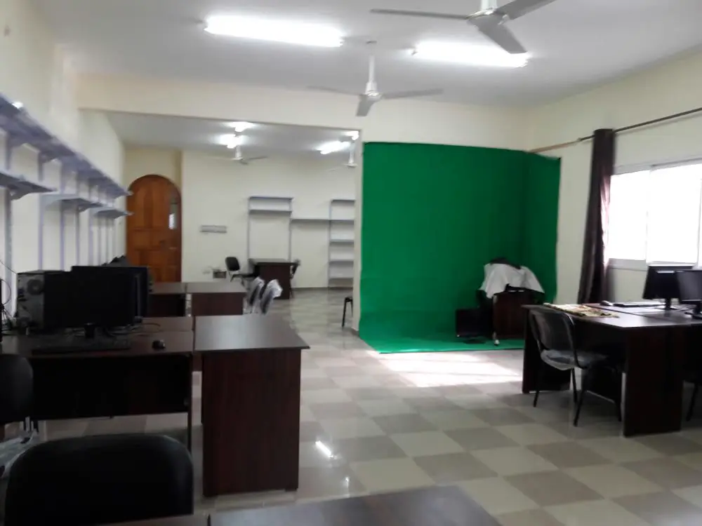 Our office with workstations and a green-screen video corner